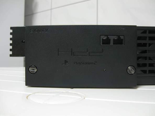Как разобрать игровую консоль Sony PlayStation 2 (7)