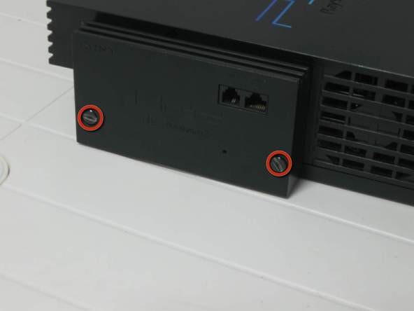 Как разобрать игровую консоль Sony PlayStation 2 (9)