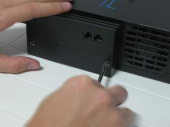 Как разобрать игровую консоль Sony PlayStation 2 (10)